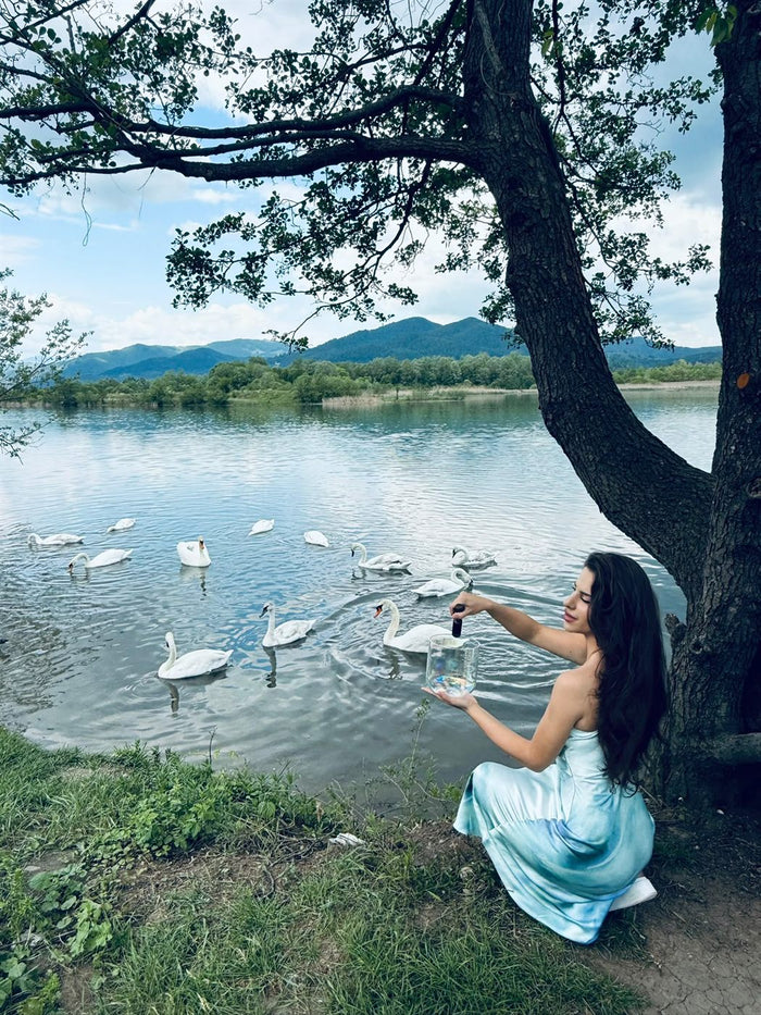 Xenia singing outdoors, among animals